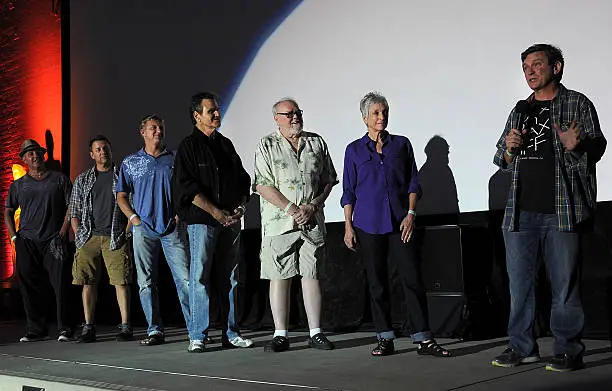 The screenwriter of The Karate Kid with 6 other members of the cast at an outdoor screening