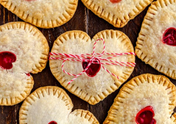 A group of heart-shaped cherry pies