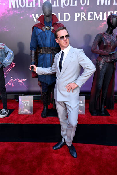 Benedict Cumberbatch standing in front of his Dr. Strange costume