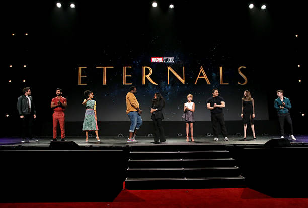 Picture of the cast of Eternals with Eternals on a black background