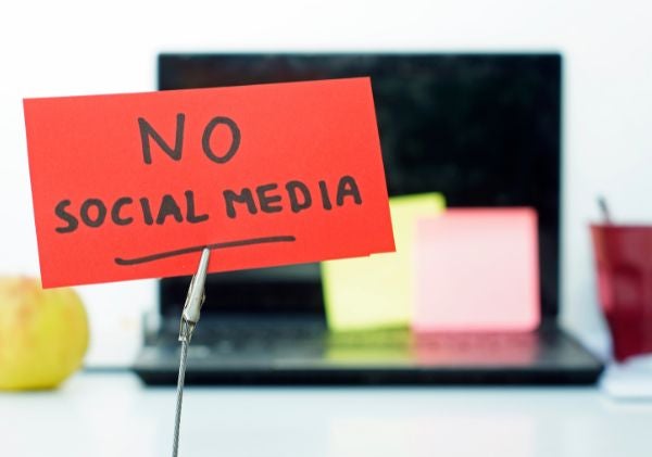 No social media sign in front of a computer