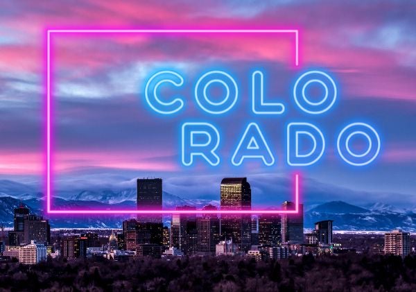 Colorado skyline with neon pink and blue Colorado sign