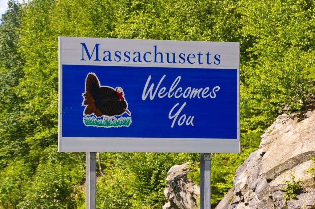 Massachusetts background with neon blue and pink Delaware sign