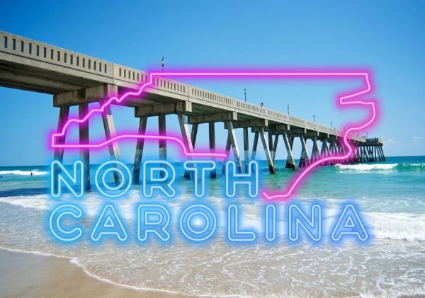 North Carolina background with pink and blue neon North Carolina sign