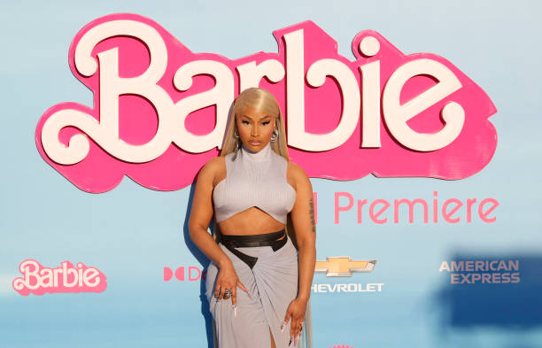 Picture of Nicki Minaj in front of a Barbie sign at the Barbie movie premiere