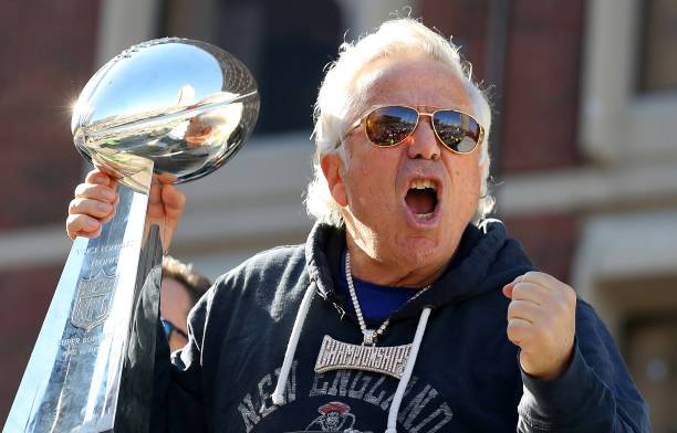Robert Kraft excited holding the Lombardi trophy
