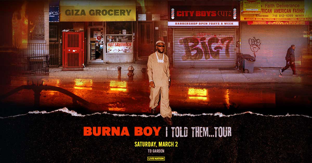 Burna Boy Told Them Tour Saturday. March 2nd at TD Garden. Burna Boy walking across the street in a city at night.