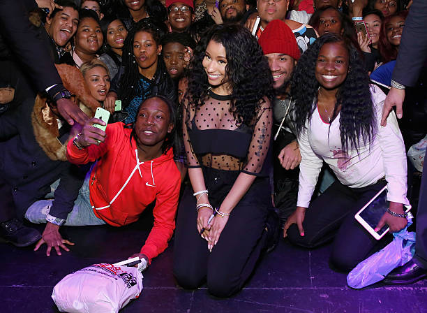Nicki Minaj poses with a group of fans
