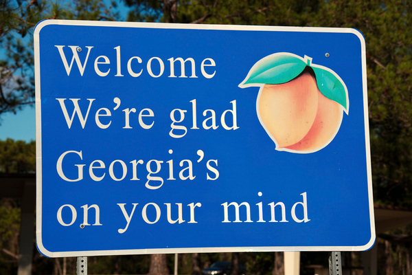 Georgia sign: Welcome, We're glad Georgia's on your mind, with a peach