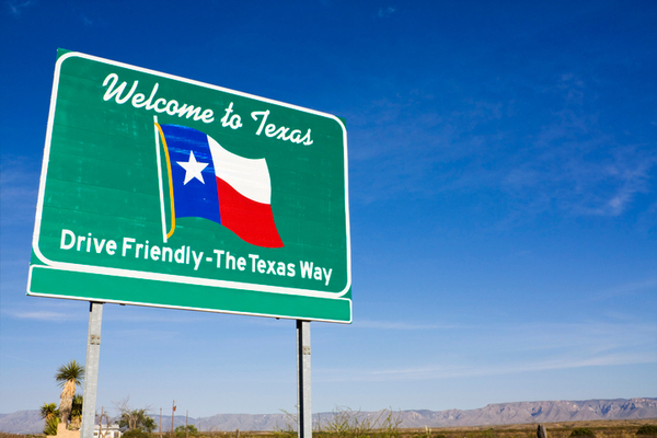 Welcome to Texas sign with state flag and 